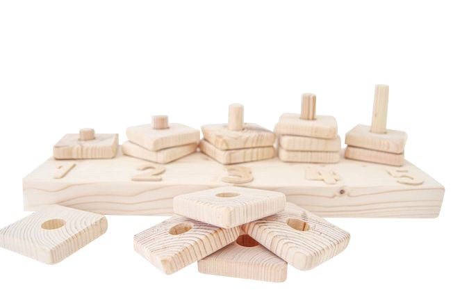 Children's numbered wooden stacking blocks on a white background
