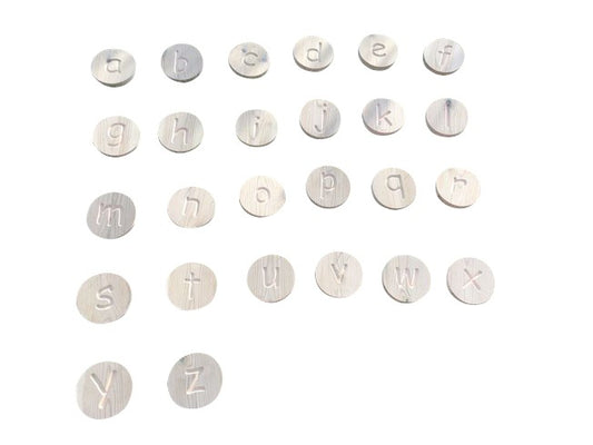 Wooden alphabet learning discs white background